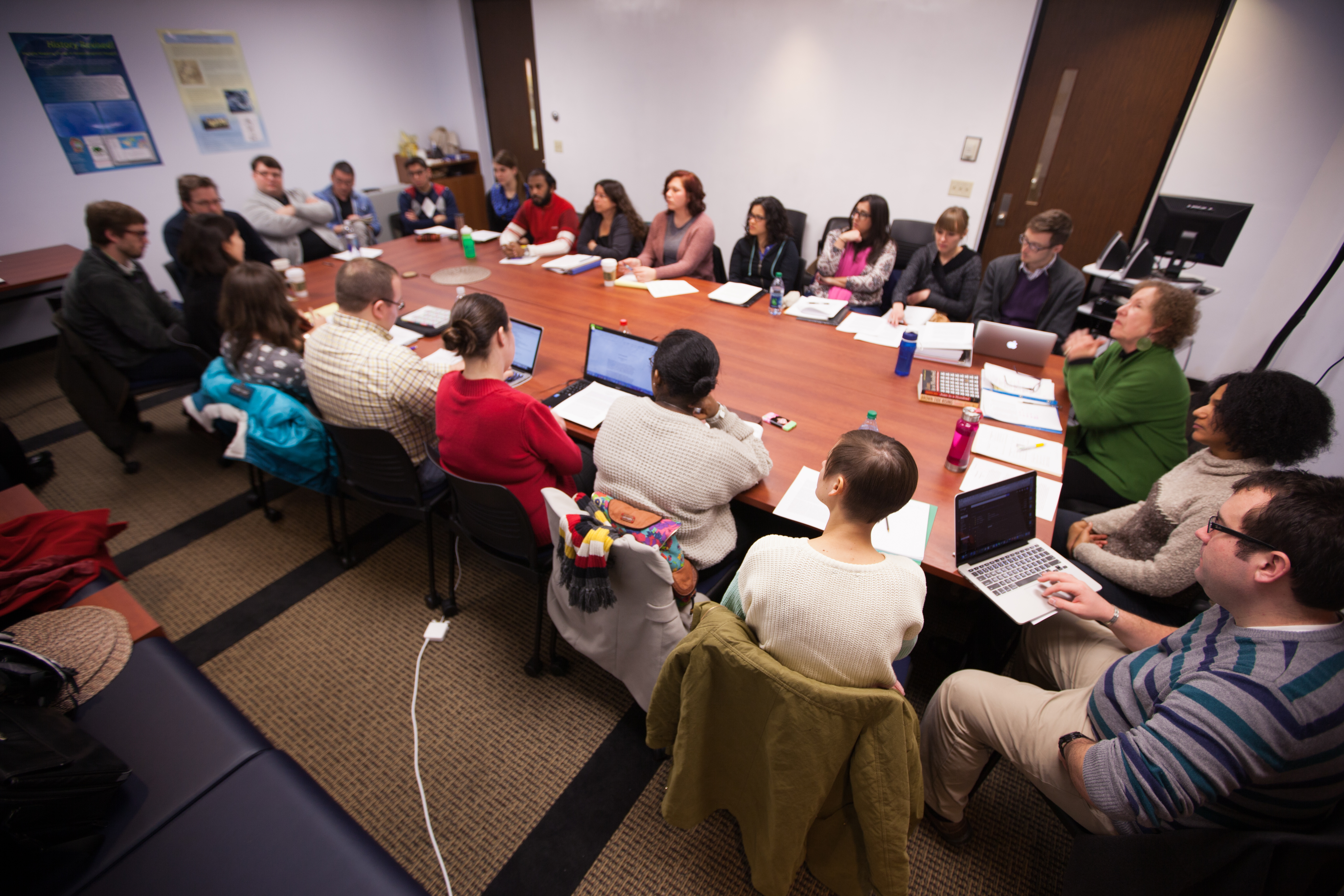 Social Theory graduate students listen to faculty discuss the course on the first day of class